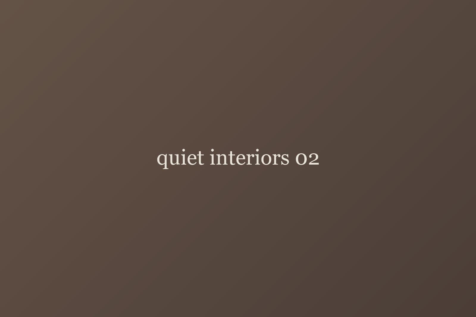 Portrait seated beside patterned curtain